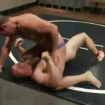 Muscled hunks duke it out in the gym, loser takes it in the ass!