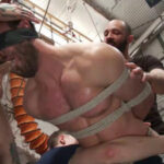 Muscled mechanic, bound, fucked from both ends, and doused with cum